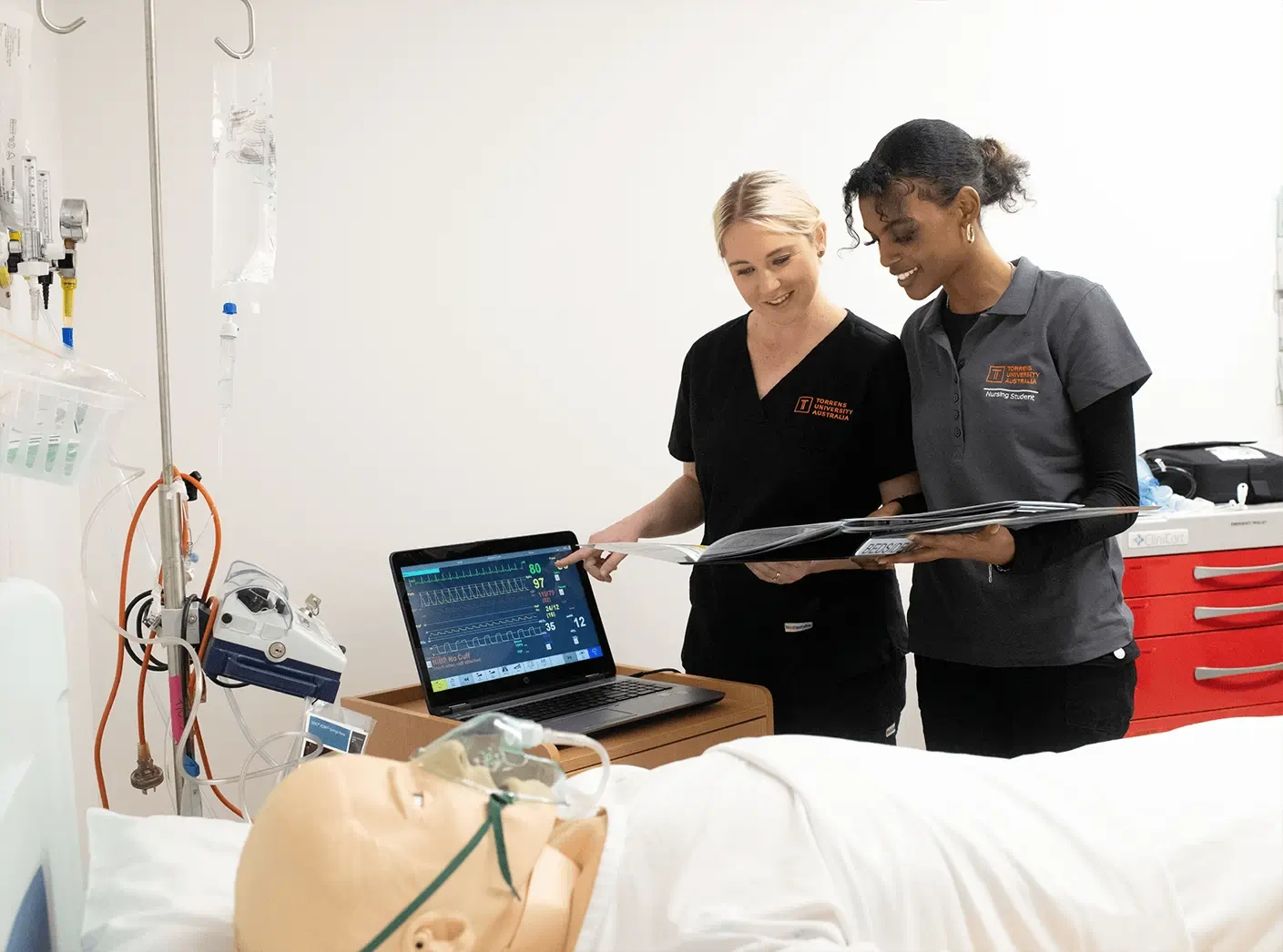 Nursing students practicing in a simulation lab