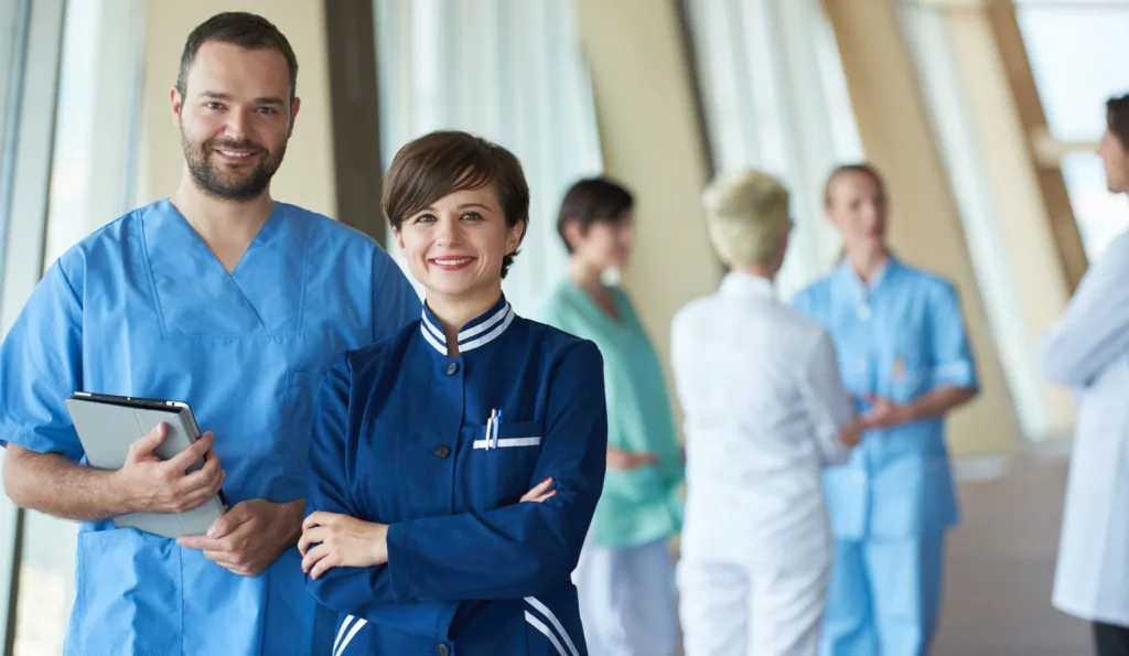 Registered nurses in Australia working together in a hospital corridor