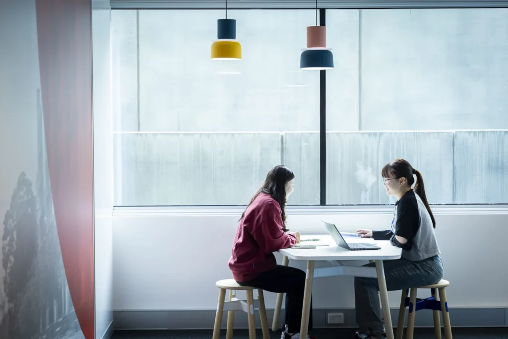 Students working on coursework in a shared study space